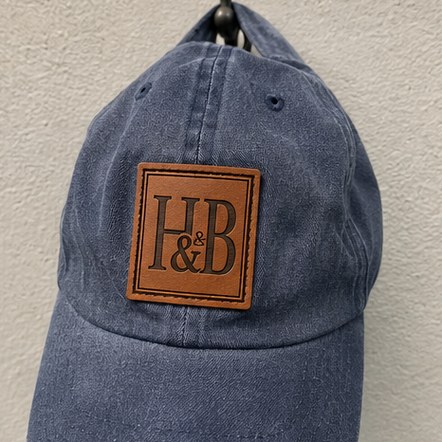 Customized leather patch hats for ranches, farms and outfitters